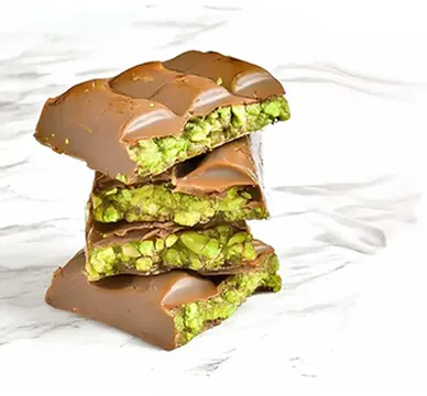 Stacked chocolate bars with kunafa and pistachio filling